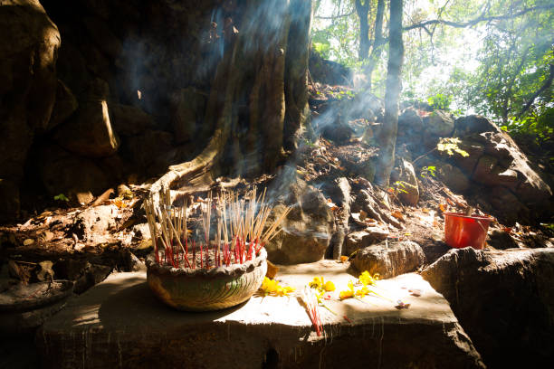istock Incense in the Forest nex to a Holy Tree, Thailand 886689656