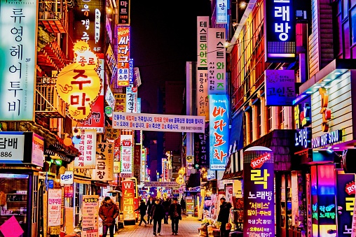 Roads with bright neon signs of the Asian city of South Korea Seoul