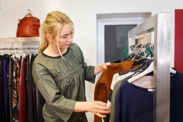 istock young woman chooses in the store 886693394