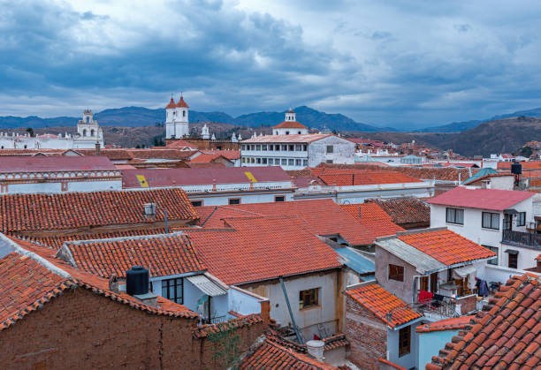 Cityscape of Sucre at dusk with a dramatic sky featuring the beautiful colonial style architecture of the city, Bolivia.