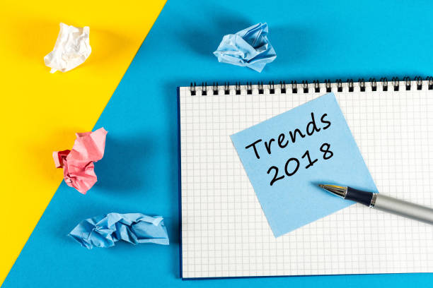 istock Trends 2018. what to expect from next year. Memo at yellow and blue background with notepad. Mockup with empty space for text 886694428