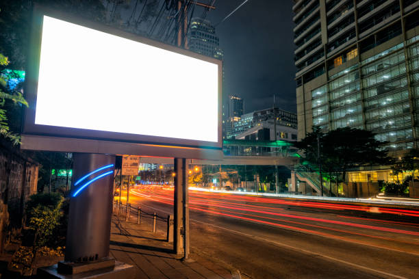 blank template for outdoor advertising or blank billboard with light trail to business district in twilight. - market asia photography outdoors imagens e fotografias de stock