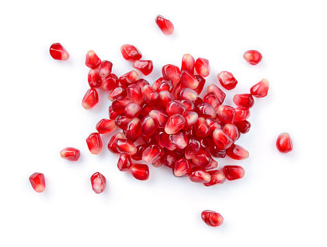 Pomegranate. Pomegranate seeds isolated on white background. Top view.