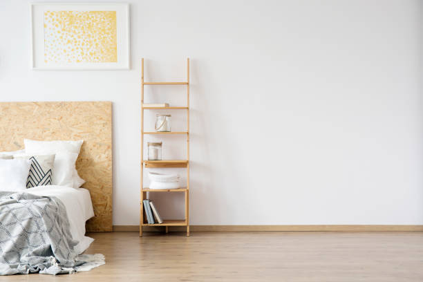 istock Simple bedroom with gold painting 886701090