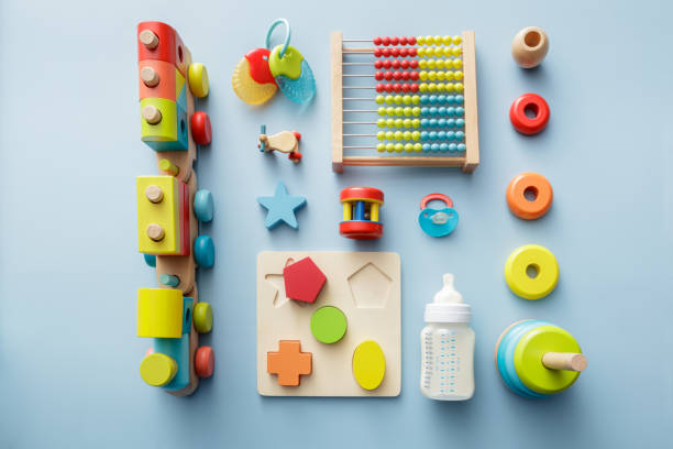 Baby Goods: Wooden Toy, Milk Bottle, Pacifier and Teething Ring Still Life