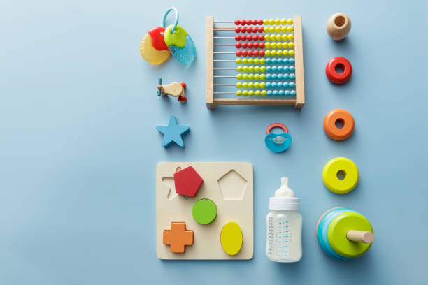 istock Baby Goods: Wooden Toy, Milk Bottle, Pacifier and Teething Ring Still Life 886701468