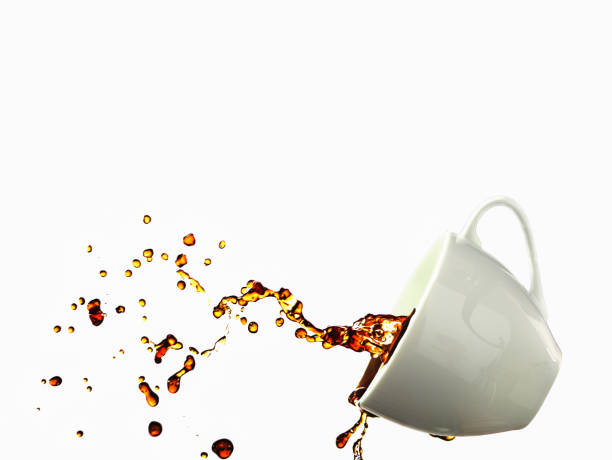 istock Coffee splashing from a cup isolated on white background 886711842