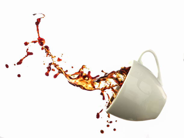 istock Coffee splashing from a cup isolated on white background 886711850