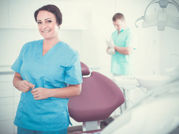 istock dentist in medical center with assistant 886720242