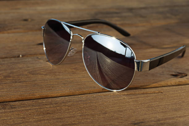istock Sunglasses is on the wood table 886725492