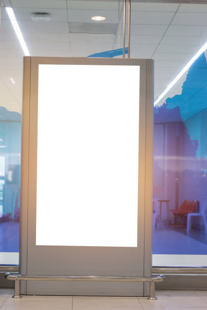 istock Blank billboard advertising panel in terminal airport, Mock up white screen, insert for text of customer. Space for texting in products or promotional at airport,train station,advertising public commercial. 886745496
