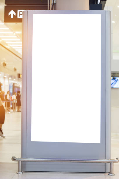 istock Blank billboard advertising panel in terminal airport, Mock up white screen, insert for text of customer. Space for texting in products or promotional at airport,train station,advertising public commercial. 886746200