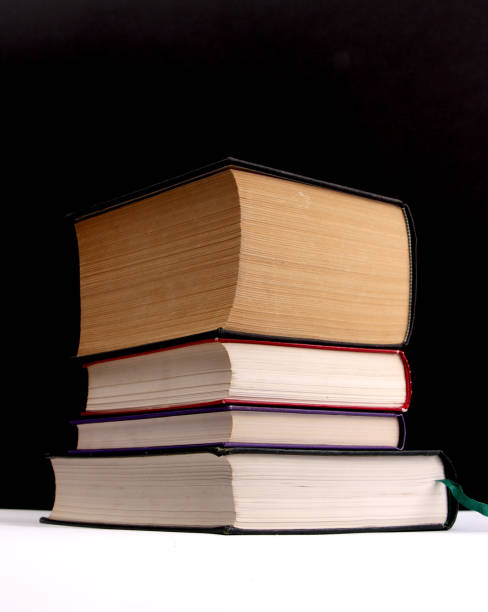 istock various colored books on a black and white background 886747328