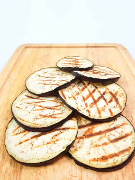 istock Grilled eggplant on cutting board on isolated white background. 886750824