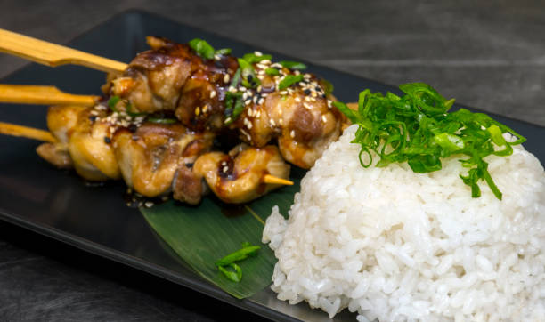 istock Teriyaki chicken skewers and rice 886750976