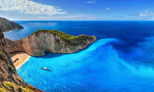 Panorama of Navagio Beach (Shipwreck Beach), Zakynthos island, Greece. Aerial view of Navagio Beach (Shipwreck Beach), Zakynthos island, Greece. greek islands stock pictures, royalty-free photos & images