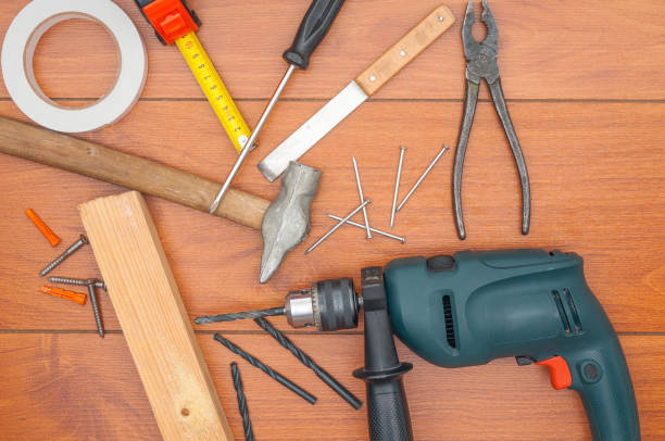 istock Different tools for repair on wooden background 886761014