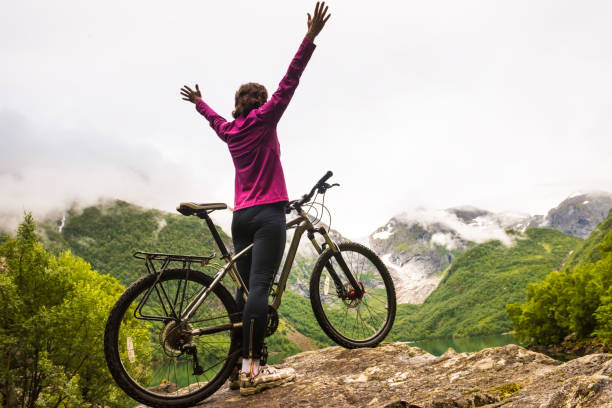 istock Biking in Norway against picturesque landscape 886761270