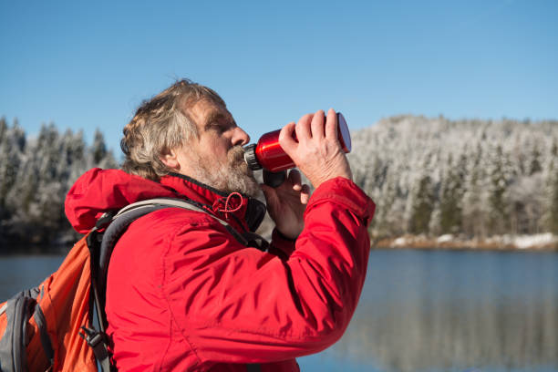 istock Senior Mountaineer in Alps, Winter 886775658