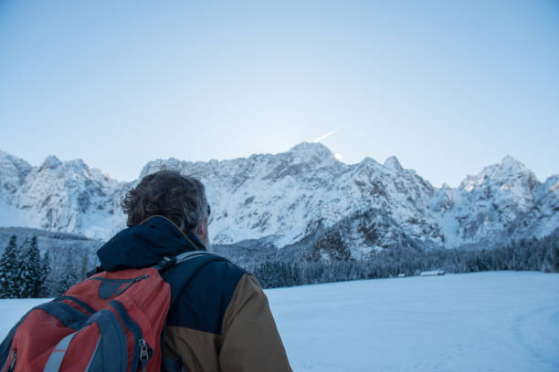 istock Senior Mountaineer in Alps, Winter 886775864