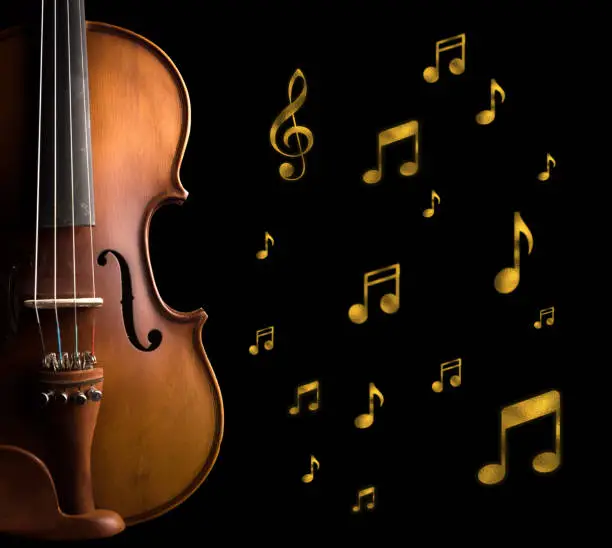 Photo of Violin and golden musical note
