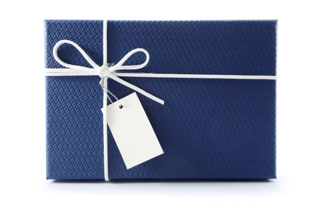 Gift box or present box with white rope bow and blank tag isolated on white background with shadow