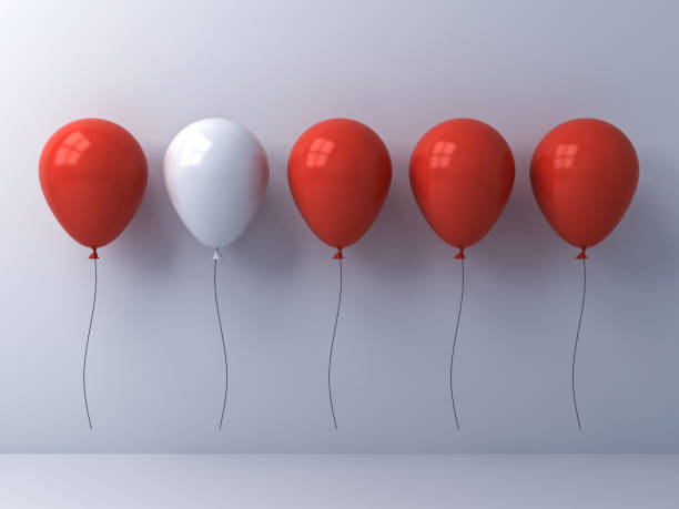 istock Stand out from the crowd and different idea concept , One white balloon among other red balloons on white wall background with reflections and shadows 886786202