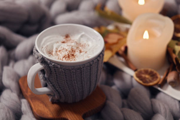 istock Cozy winter evening , cup of coffee, soft blanket, candles. Comfy lifestyle. 886786320