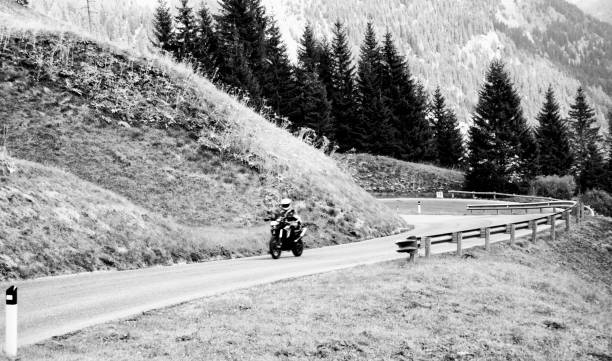 istock Biker on mountain road, European Alps. 886794288