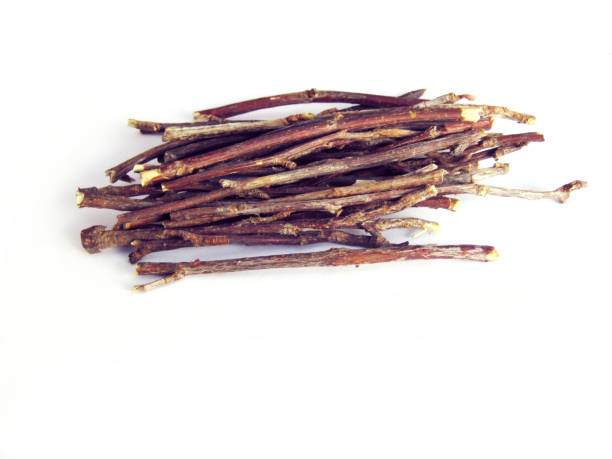 Stack of wooden twigs isolated on white