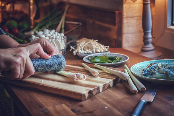 istock Cutting Lemon Grass for Tom Yum Goong Nam Kon Thai Soup 886801056