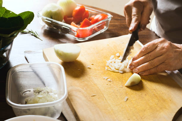 istock Woman chopping onion 886810984
