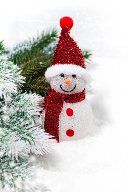 istock christmas snowman in fir branches on a white background 886813282