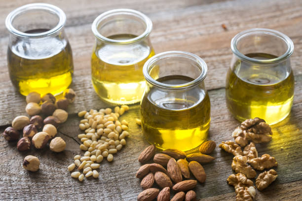 istock Glass jars with different kinds of nut oil 886850468