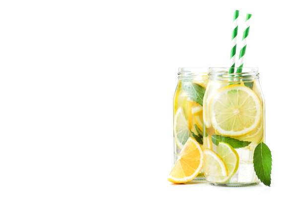 istock fresh lemonade bottle glass  with fruits isolated 886850804