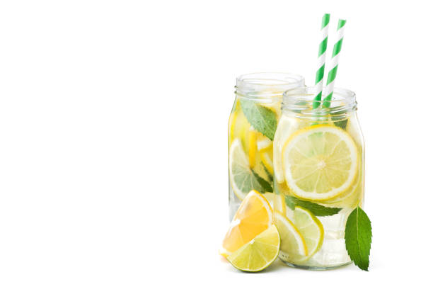 istock fresh lemonade bottle glass  with fruits isolated 886850882