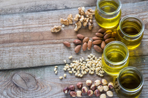 istock Glass jars with different kinds of nut oil 886850970