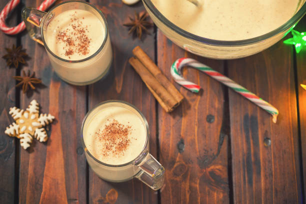 Eggnog at Christmas Time Homemade eggnog with cinnamon for Christmas glass of bourbon stock pictures, royalty-free photos & images