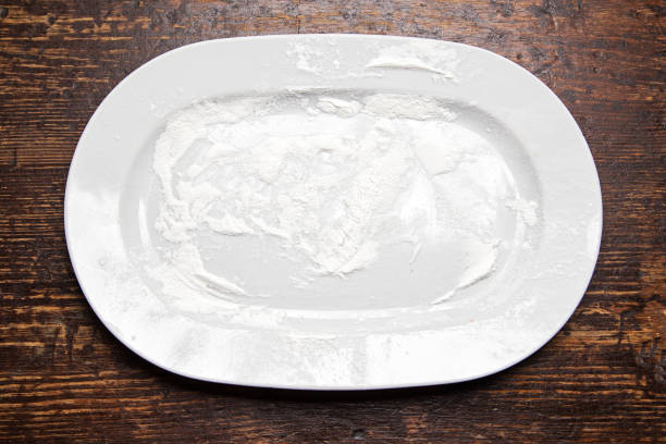 istock plate with flour on a wooden table 886853986