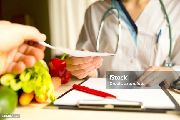 Vegetable Diet Nutrition And Medication Concept Nutritionist Offers Healthy Vegetables Diet Stock Photo - Download Image Now