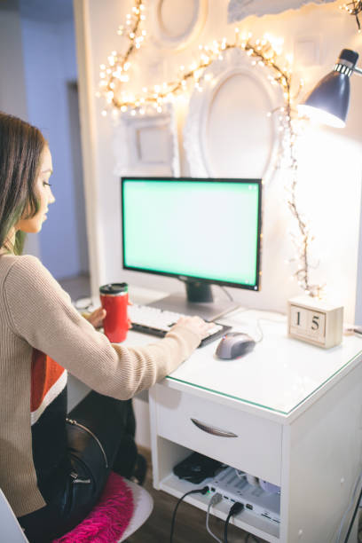 istock Young woman working on laptop in the office 886864770