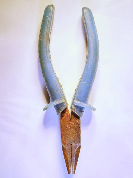 istock old pliers with blue pens on a white background 886875388