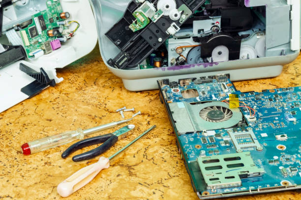 istock On the desktop is disassembled equipment and tools for repair. 886878506