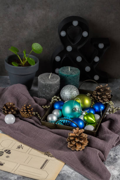 istock Christmas decorations, balls, candles. Blue, white and gray. 886878672