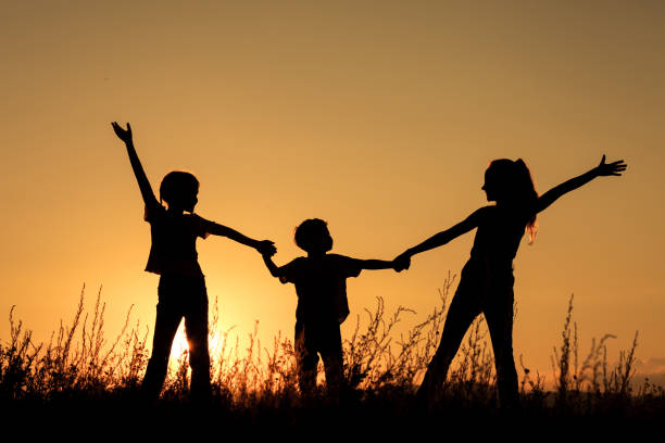 istock Happy children playing in the park. 886884082