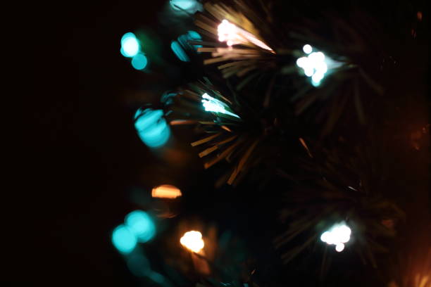 istock christmas tree illumination in a black background 886884104
