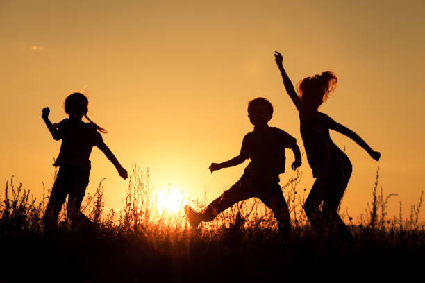istock Happy children playing in the park. 886884200