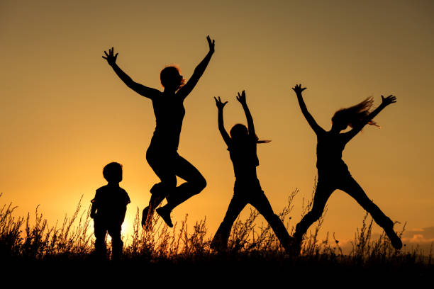 istock Happy family standing in the park. 886884304