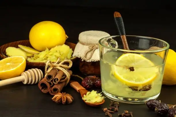 Ginger lemon honey and rosehip tea against influenza. Hot tea for colds. Home Pharmacy