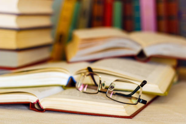 istock on the table are many books and glasses. 886884498